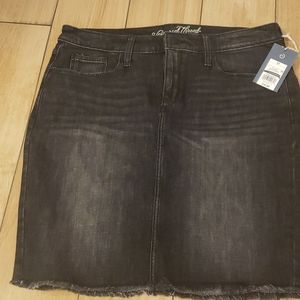 Womans black demin skirt with the bottom frayed